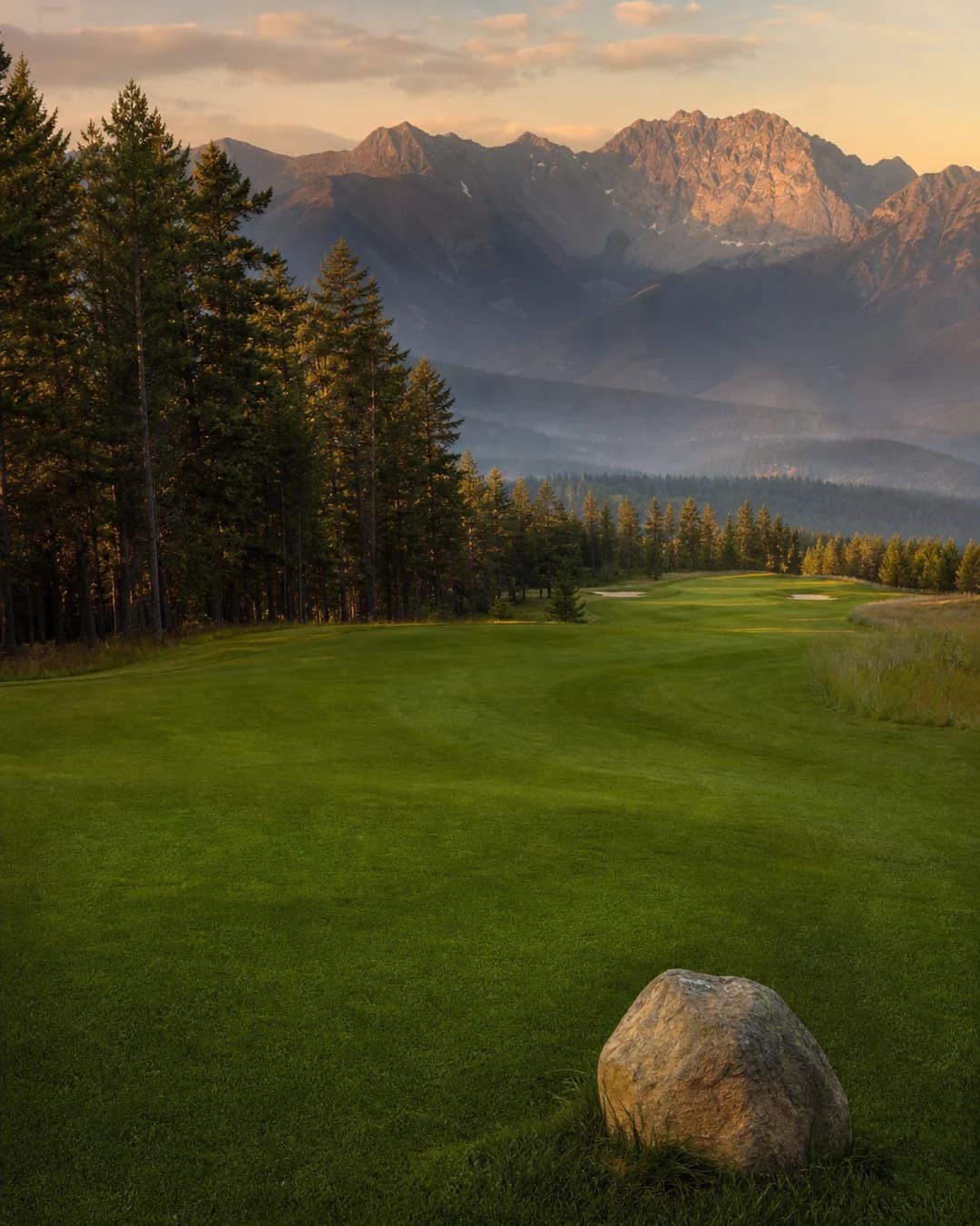 A golf fairway backed by the Rockies near Radium